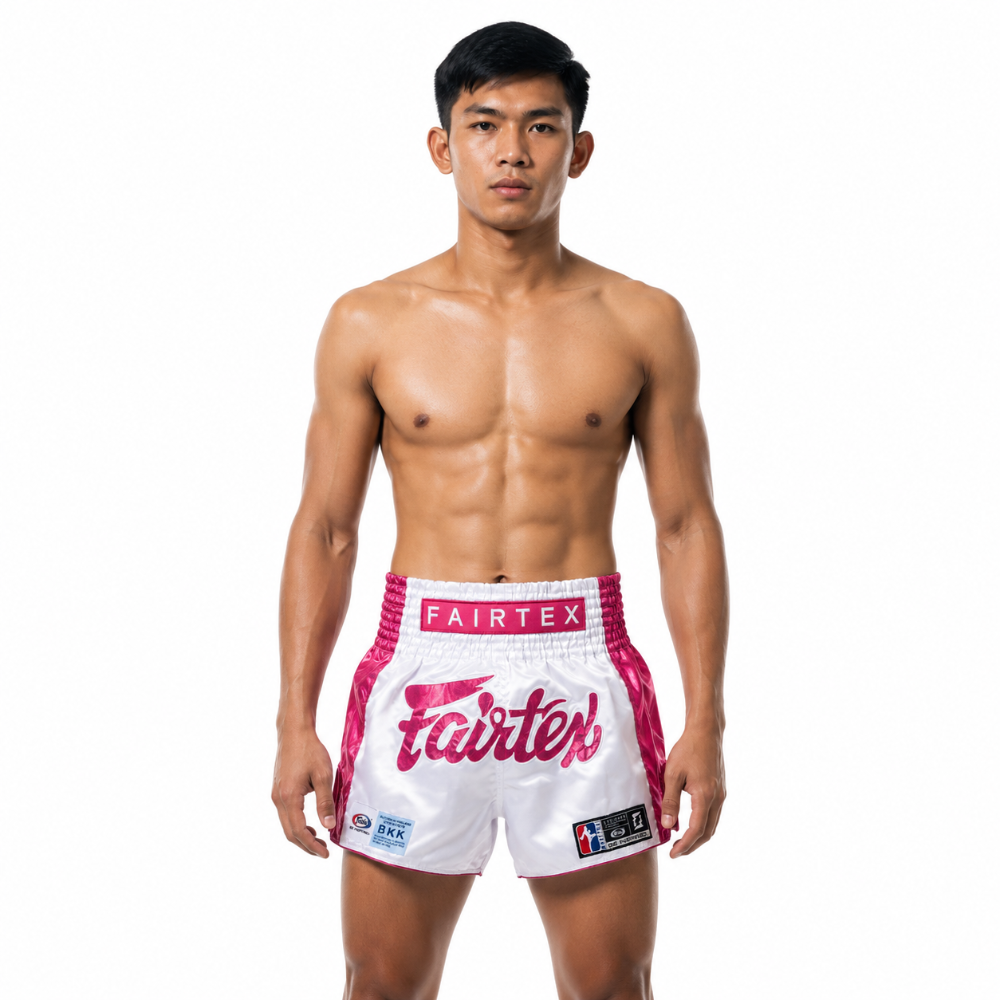 Fairtex Muay Thai Shorts Pink Strike in white and metallic pink satin with Fairtex logo